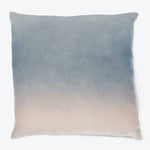 Square pillow with gradient design adds style and comfort.