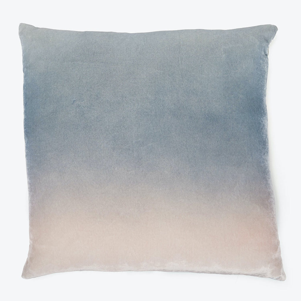 Square pillow with gradient design adds style and comfort.