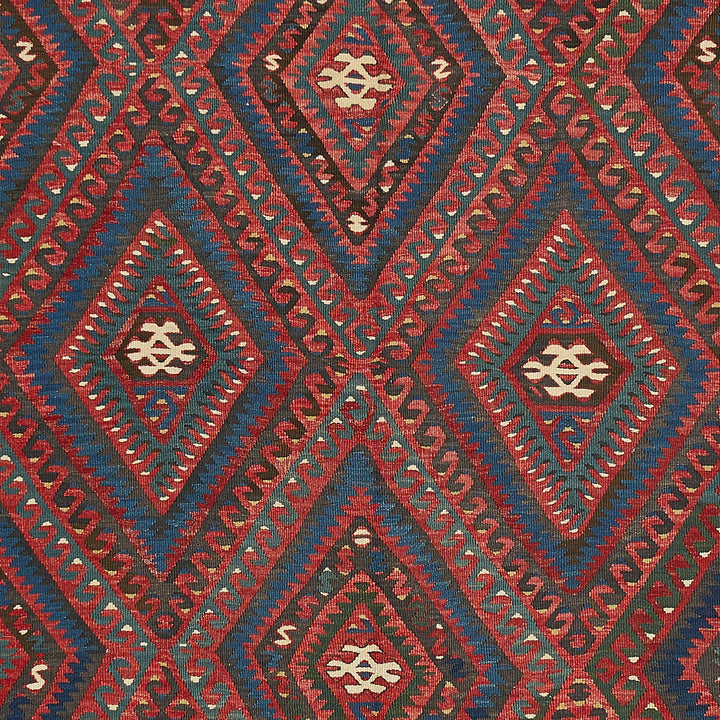 Intricate geometric textile design showcases cultural symbolism and fine craftsmanship.