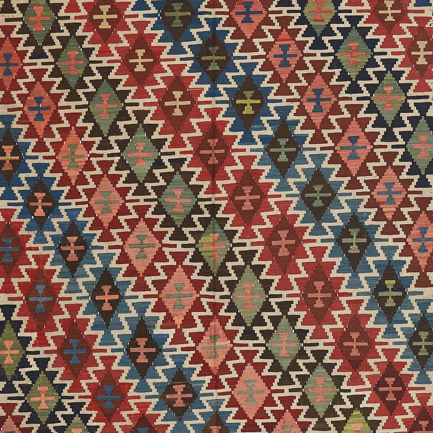 Vibrant and intricate textile with symmetrical geometric pattern and motifs.