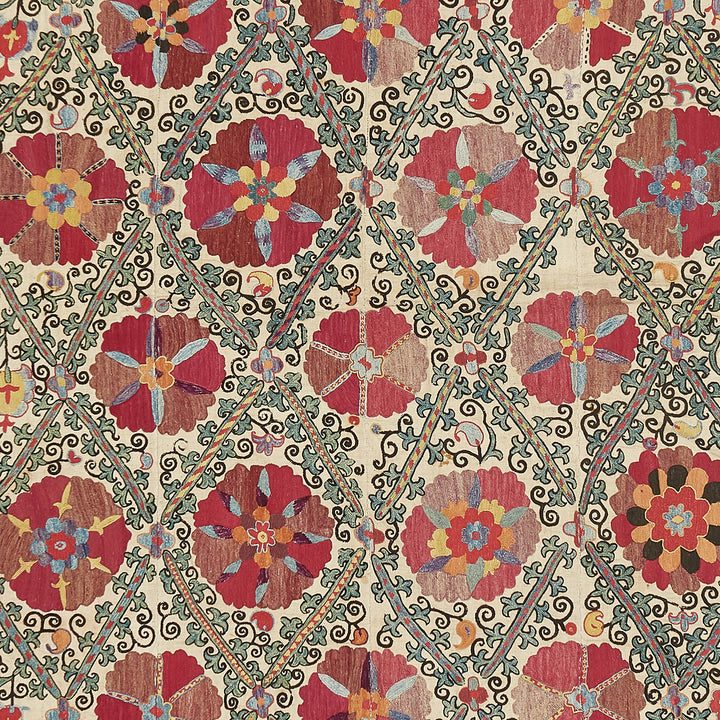 Vibrant floral textile pattern with curving lattice-like lines in contrasting color.