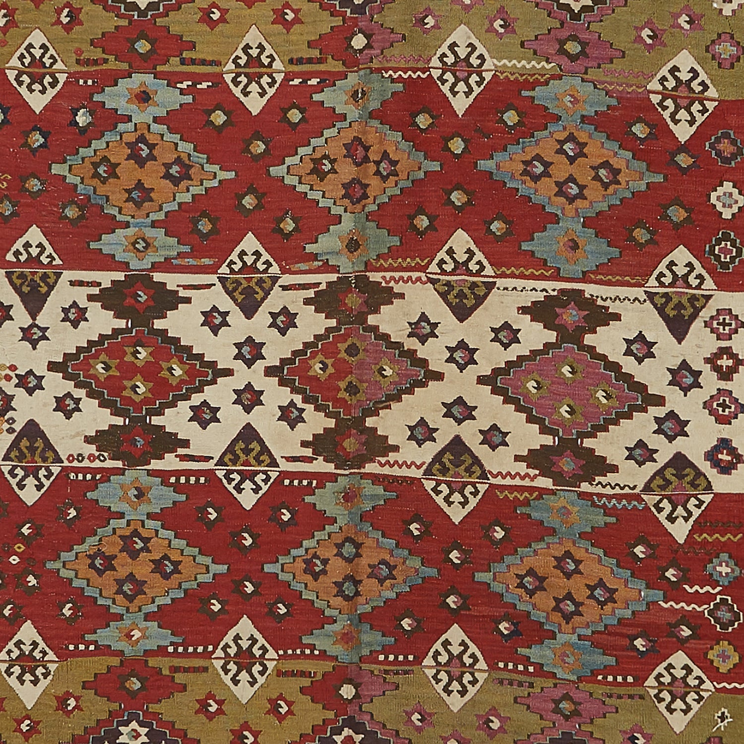 Richly patterned rug showcases intricate geometric design in warm hues.