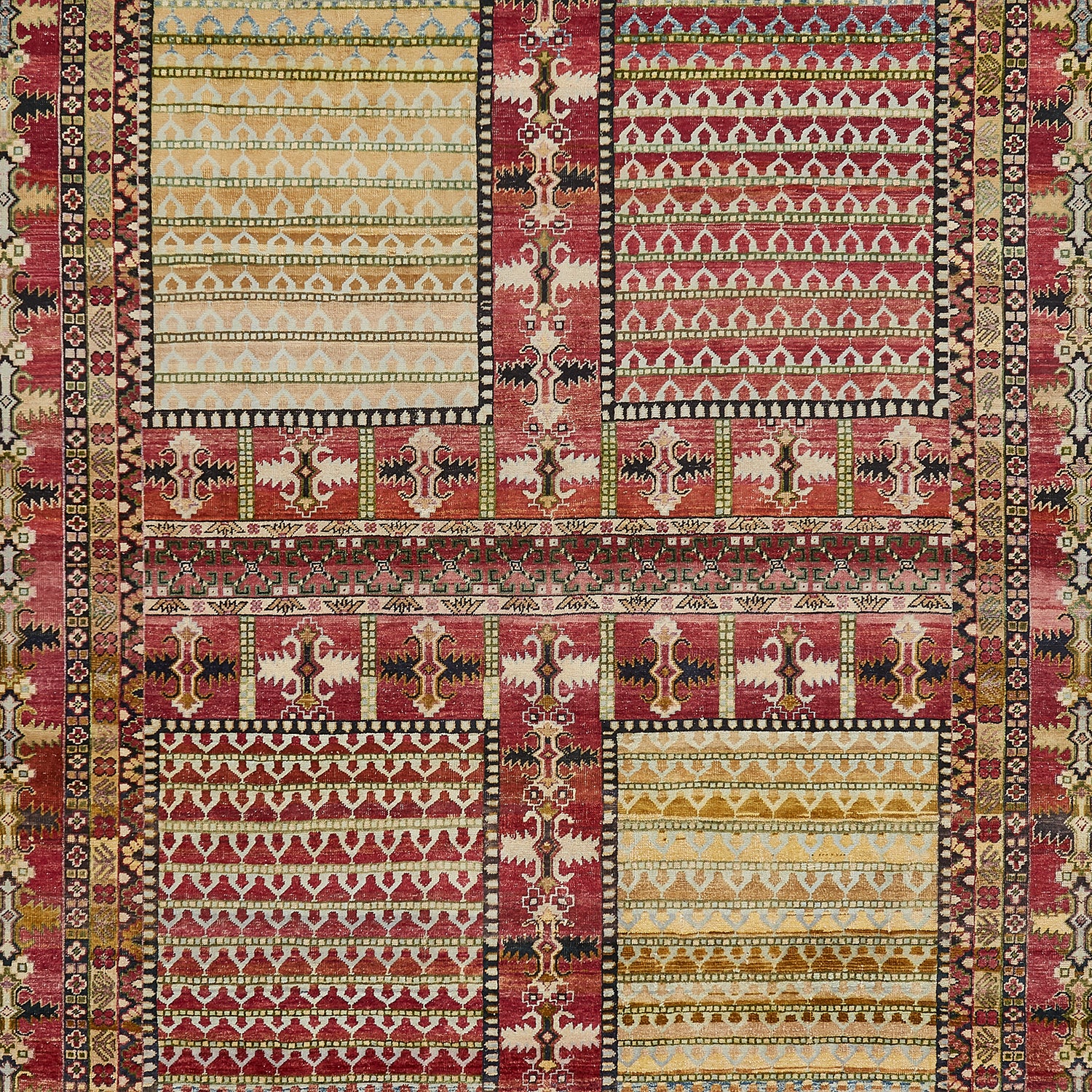 Exquisite traditional rug showcases intricate patchwork of vibrant colors and patterns.