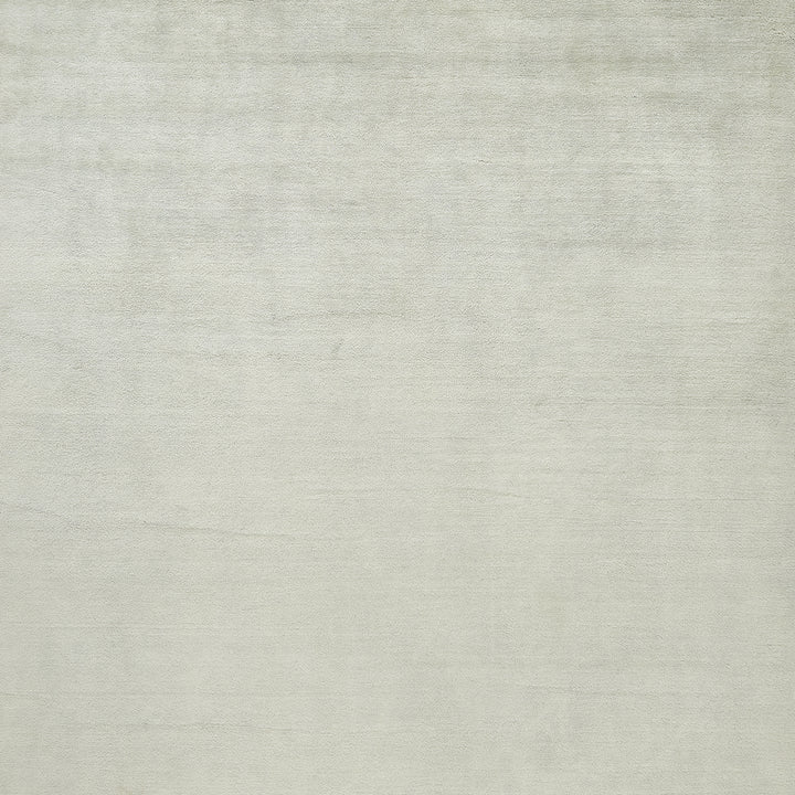 Soft, textured off-white fabric with subtle variations in shading.