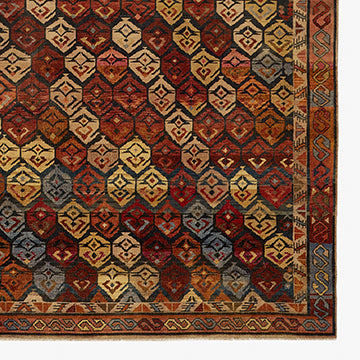 Exquisite hand-woven rug with intricate geometric patterns and vibrant colors.