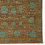 Exquisite Persian-inspired rug showcases intricate teal floral motifs on warm brown background.