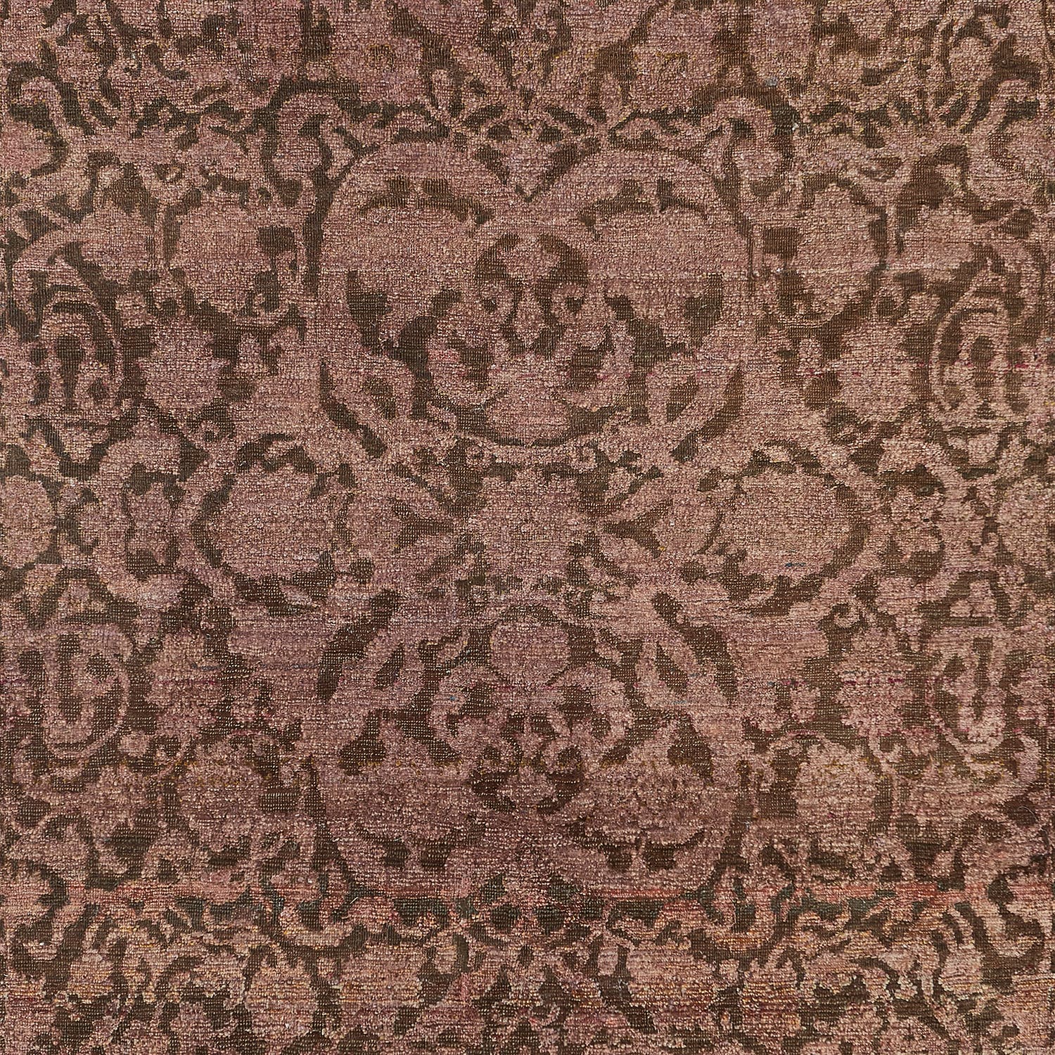 Intricate, classical patterned textile in brown tones with antique charm.