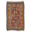 Handwoven geometric patterned rug with fringe, traditional Middle Eastern design