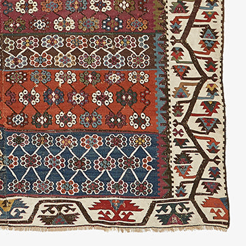 Vibrant, intricate hand-woven rug showcases traditional patterns and craftsmanship.