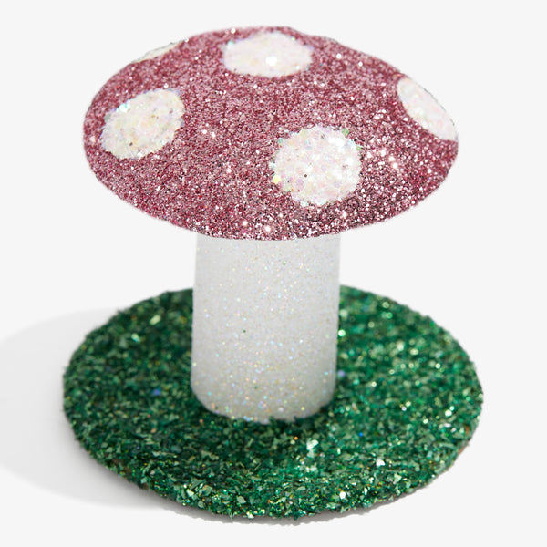 Sparkling mushroom decor with burgundy cap and glittery white spots.