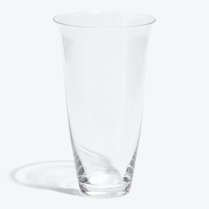 Empty conical glass in pristine condition against white backdrop.