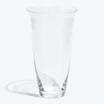 Empty conical glass in pristine condition against white backdrop.