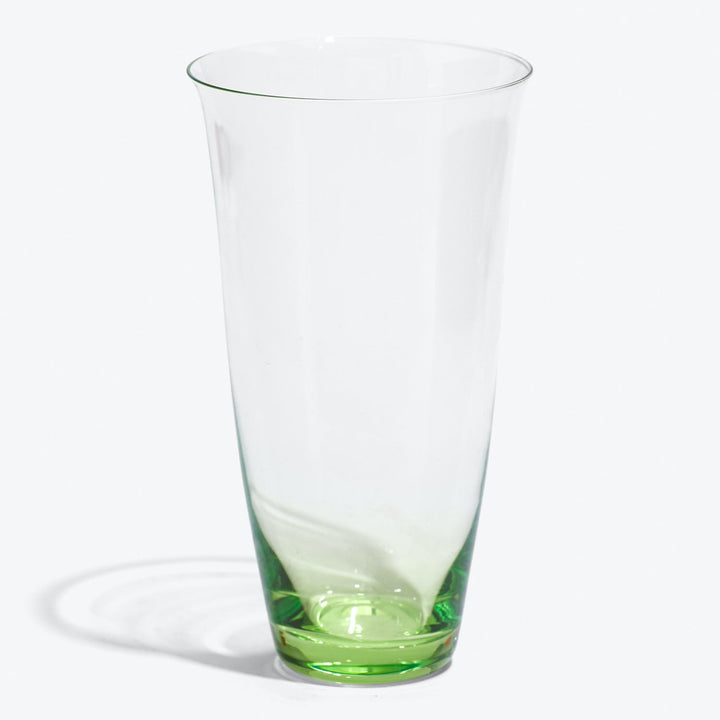 Transparent glass with a gradual green tint, reflecting light softly.