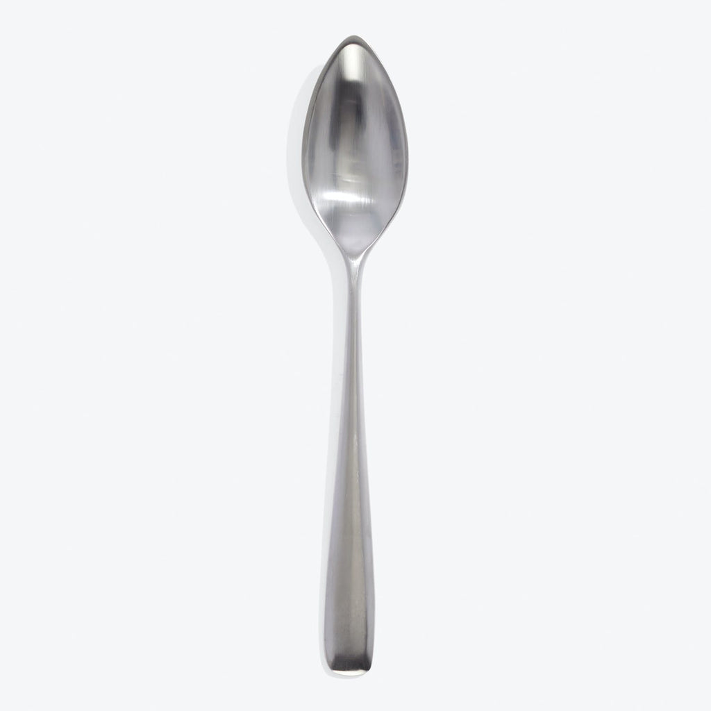 Polished stainless steel spoon with clean, modern design and reflection.