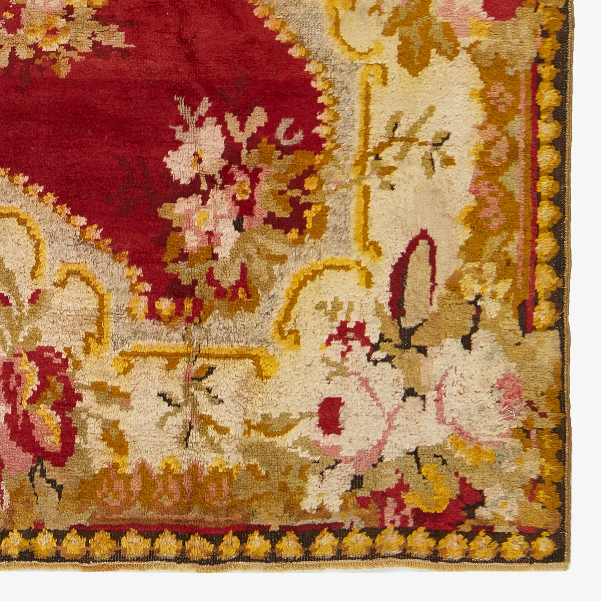 Close-up of an ornately patterned rug showcasing intricate floral motifs.