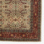 Intricate floral rug with harmonious design and richly decorated border.
