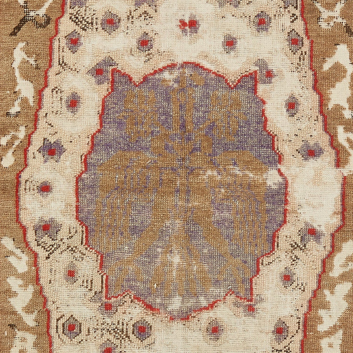 Intricate symmetrical patterned fabric with floral motifs and rich colors.