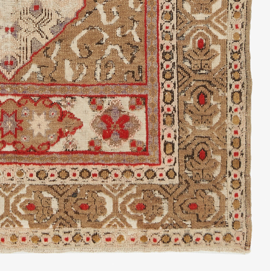 Intricately patterned handwoven rug featuring elaborate designs and craftsmanship.