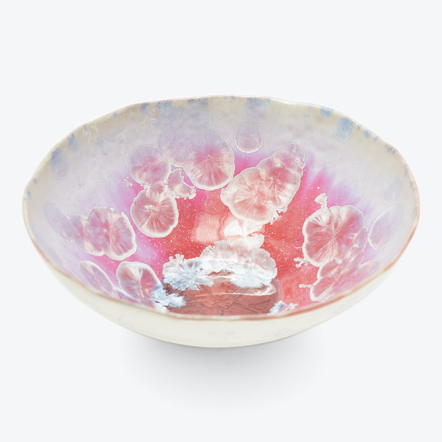 Exquisite floral patterned bowl with translucent flowers in shades of pink, white, and blue.