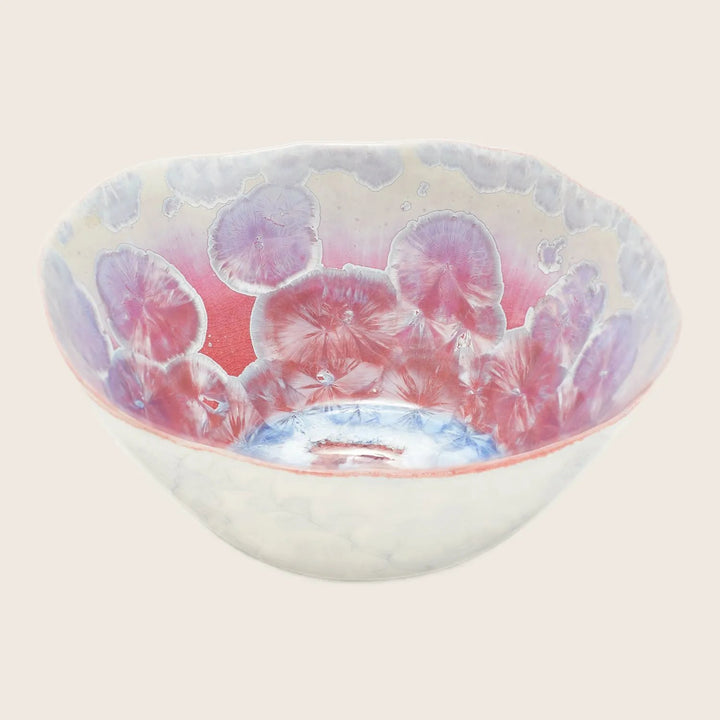 Decorative ceramic bowl with floral design in pink and blue