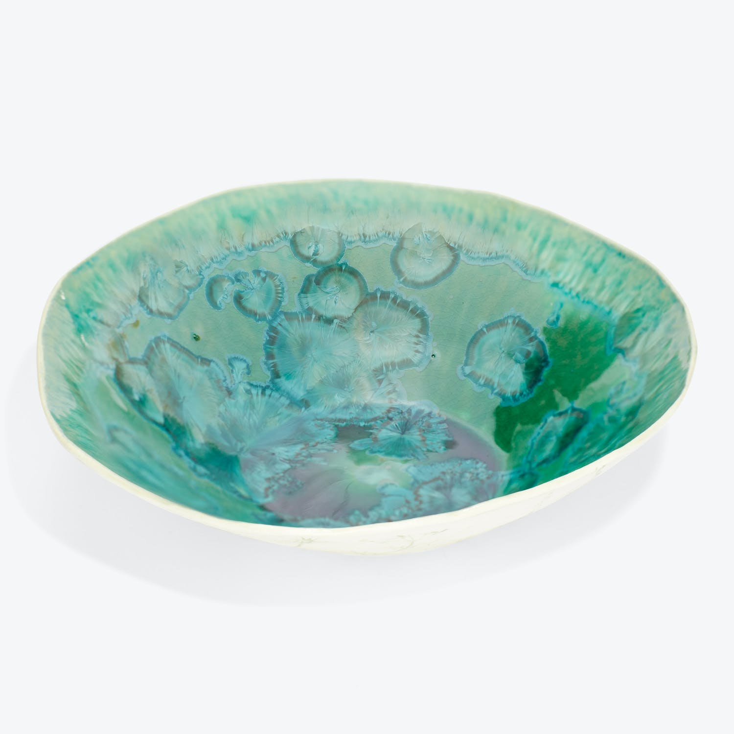 Vibrant decorative bowl with undulating rim evokes watercolor painting aesthetic.