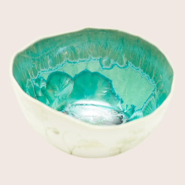 Handcrafted ceramic bowl with textured interior and decorative exterior design
