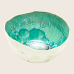 Handcrafted ceramic bowl with textured interior and decorative exterior design