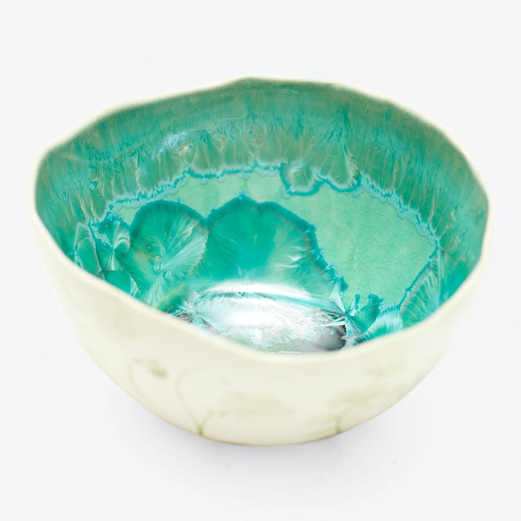 Handcrafted ceramic bowl with textured interior and decorative exterior design