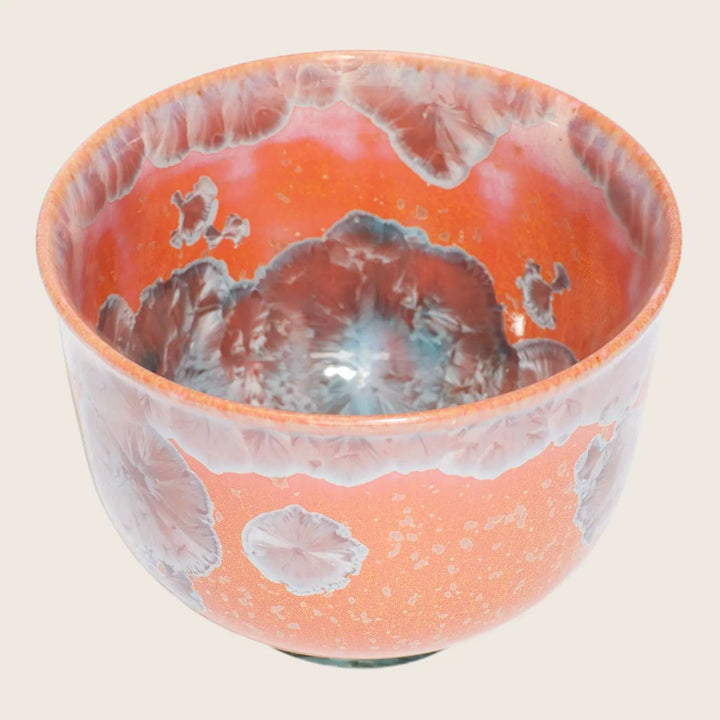 Exquisite ceramic bowl showcases intricate glaze patterns and impeccable craftsmanship.