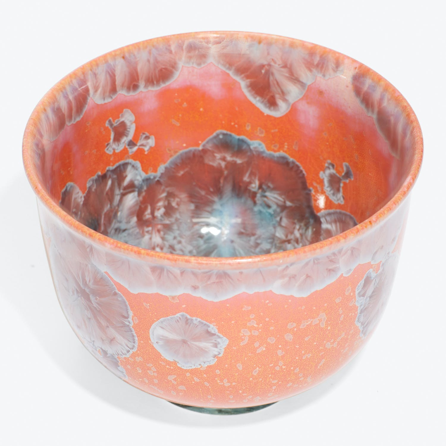 Exquisite ceramic bowl showcases intricate glaze patterns and impeccable craftsmanship.
