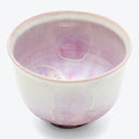 Delicate floral patterned ceramic bowl with pale pink hue