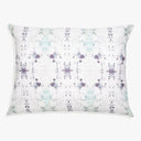 Rectangular decorative pillow with tie-dye pattern in various blues.