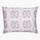 Symmetrical tie-dye pillow with pastel shades and plush fabric.