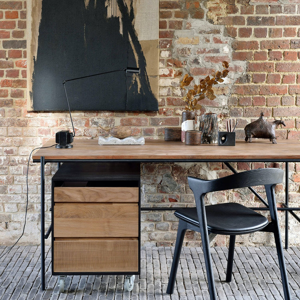 Contemporary workspace with minimalist design and rustic-modern interior elements.
