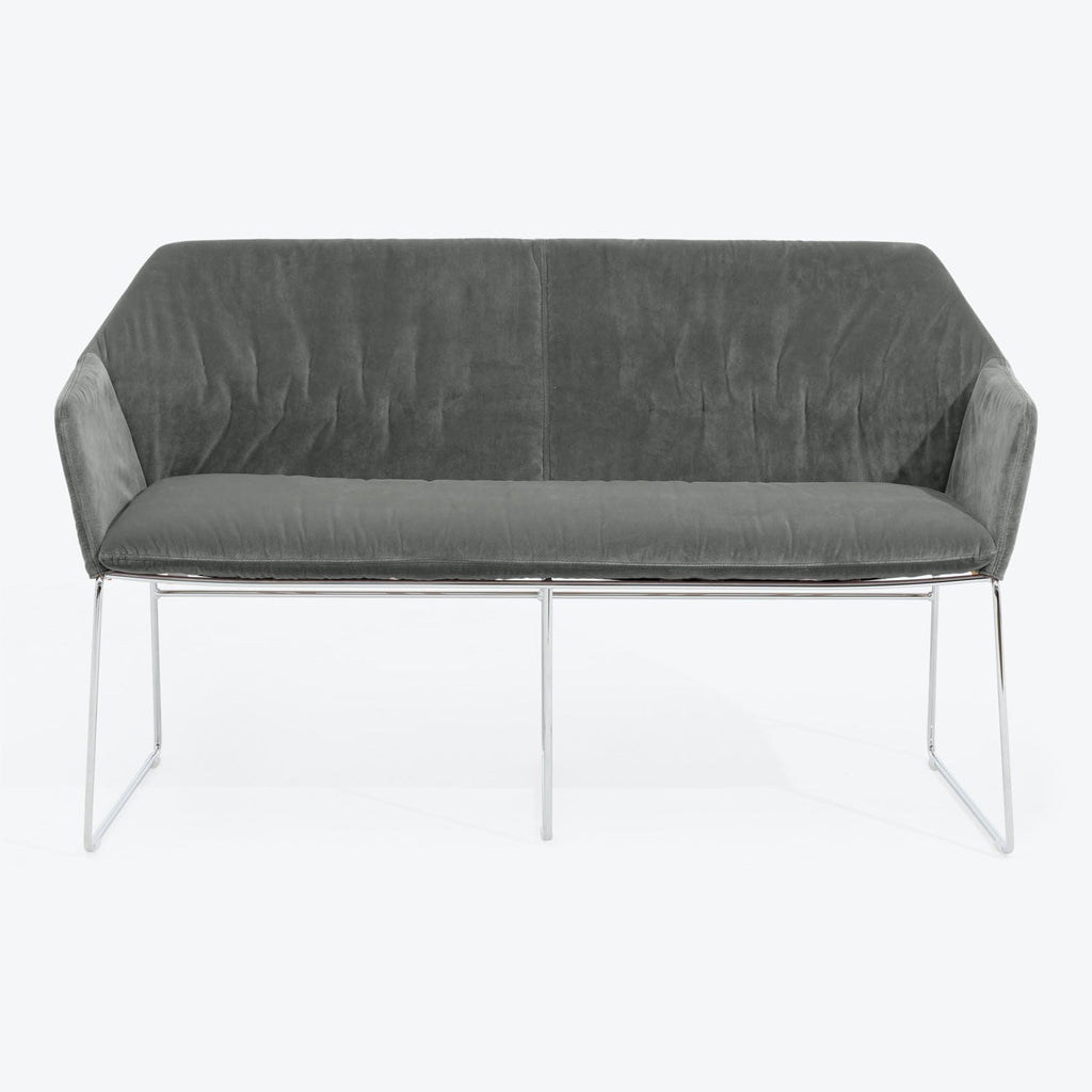 Modern-style gray velvet sofa with sleek design and chrome legs.