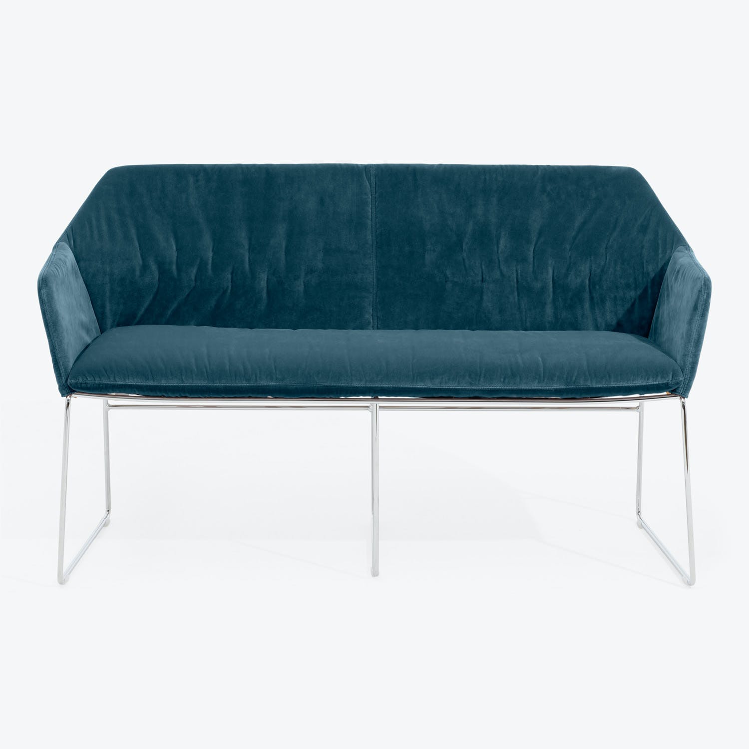Contemporary blue velvet sofa with sleek design and plush cushions.