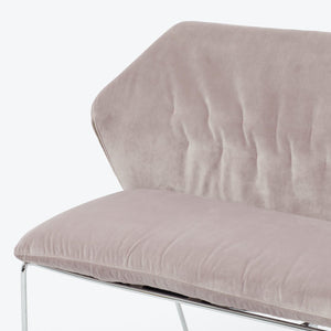 Modern-style loveseat with curved backrest and sleek metal frame. - hover