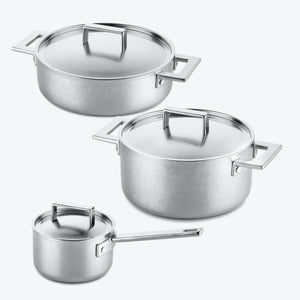 Set of three metal pots with lids in varying sizes.