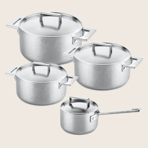 Versatile nesting set of stainless steel pots with modern design.