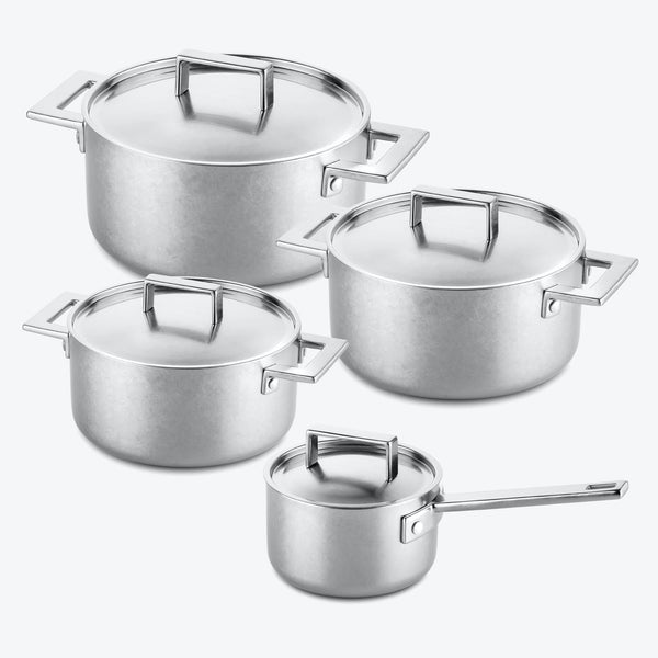 Versatile nesting set of stainless steel pots with modern design.