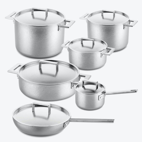 Set of stainless steel cookware with various pot sizes and sleek design.