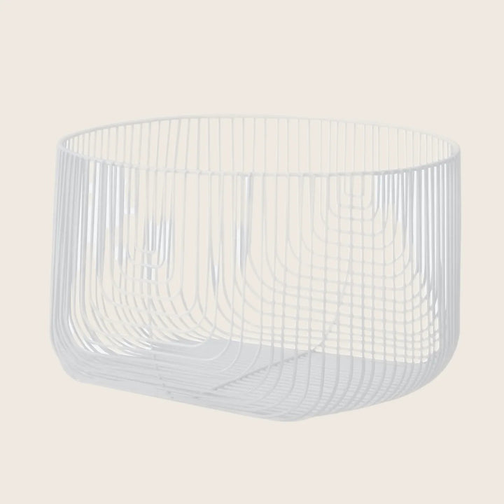A contemporary wire basket with a minimalist design and versatile usage.