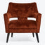 Modern armchair in burnt orange adds warmth to any space.