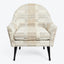 Neutral-toned plaid armchair with rounded back and thick cushion.