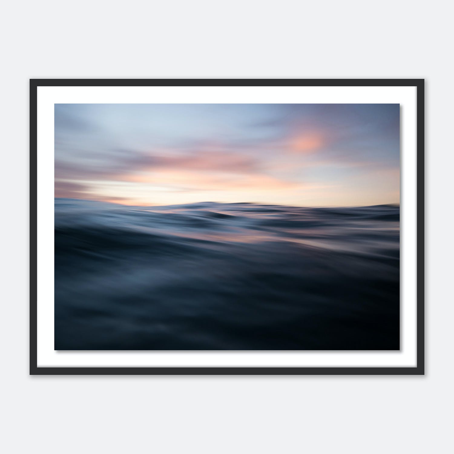 Serene seascape captures the dynamic movement of water at dusk.