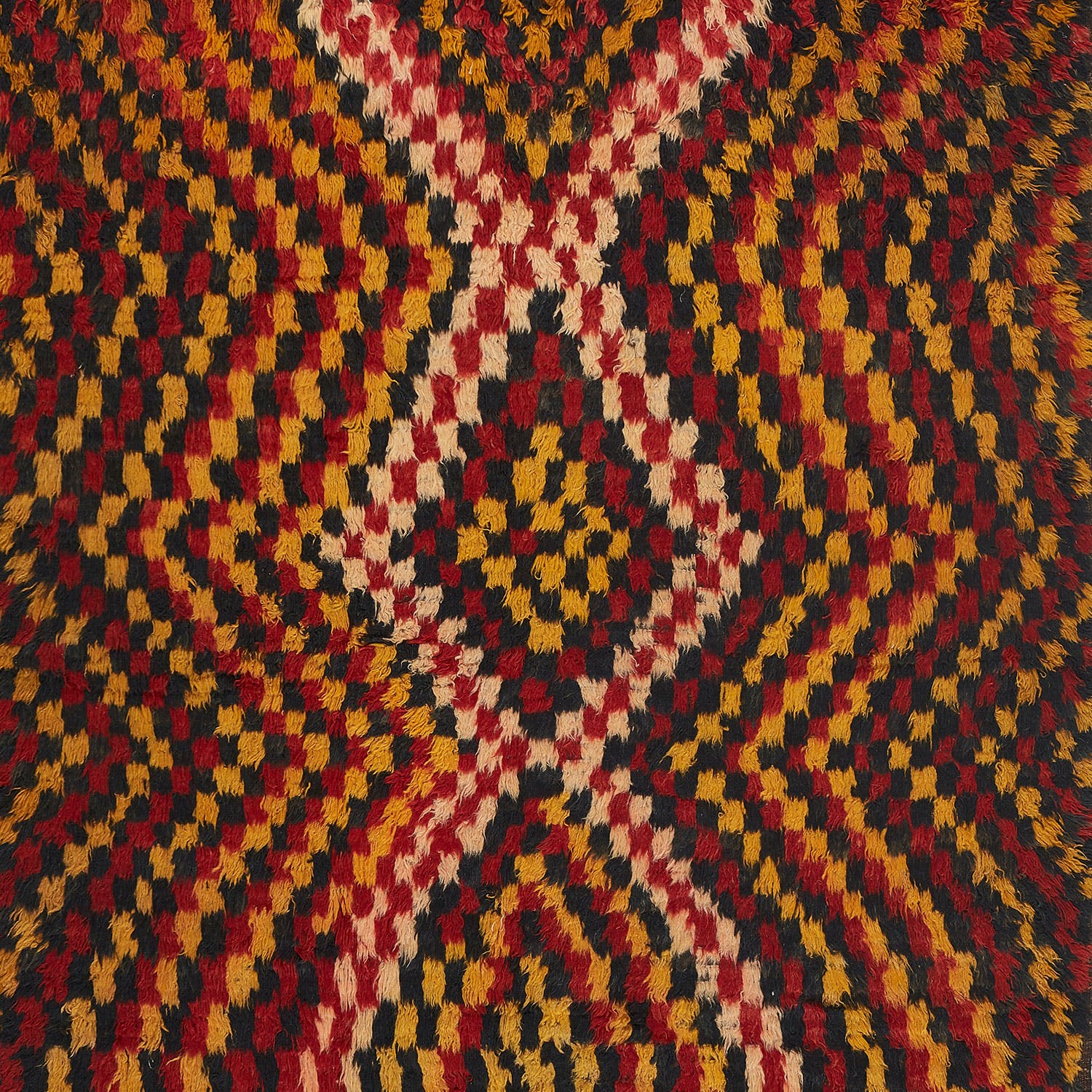 Close-up of vibrant, symmetrical fabric pattern with intricate geometric design.