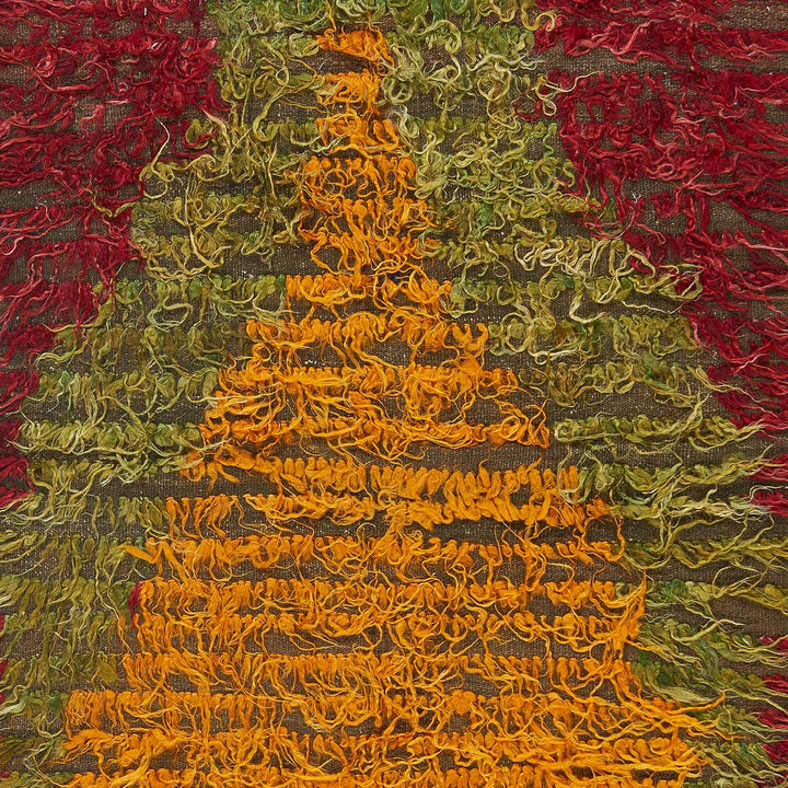 Close-up shot of vibrant, textured fabric with rich gradient colors.