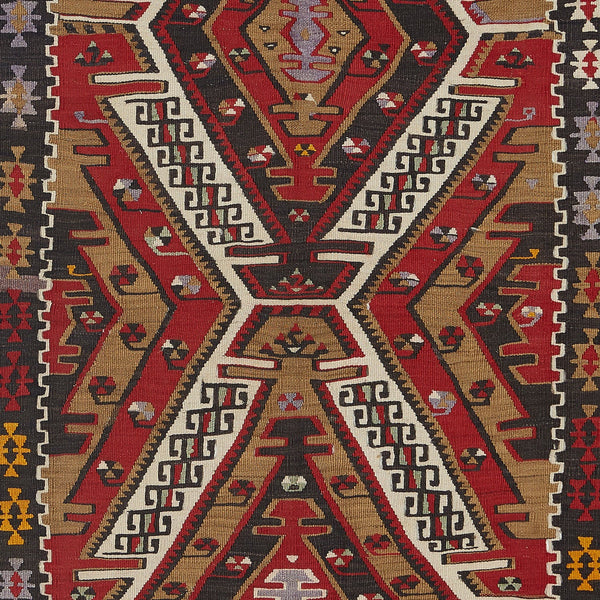 Exquisite traditional handwoven rug showcases intricate geometric motifs and symbols.