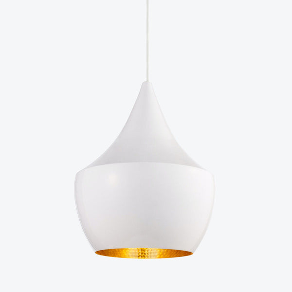Elegant pendant light with golden interior creates warm ambiance.