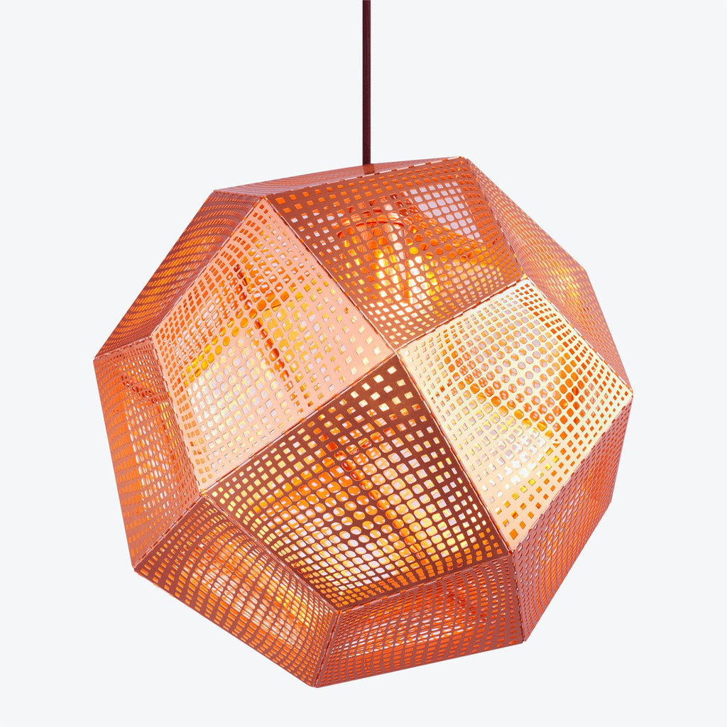 Geometric pendant light fixture casts warm gradient glow through perforated panels.